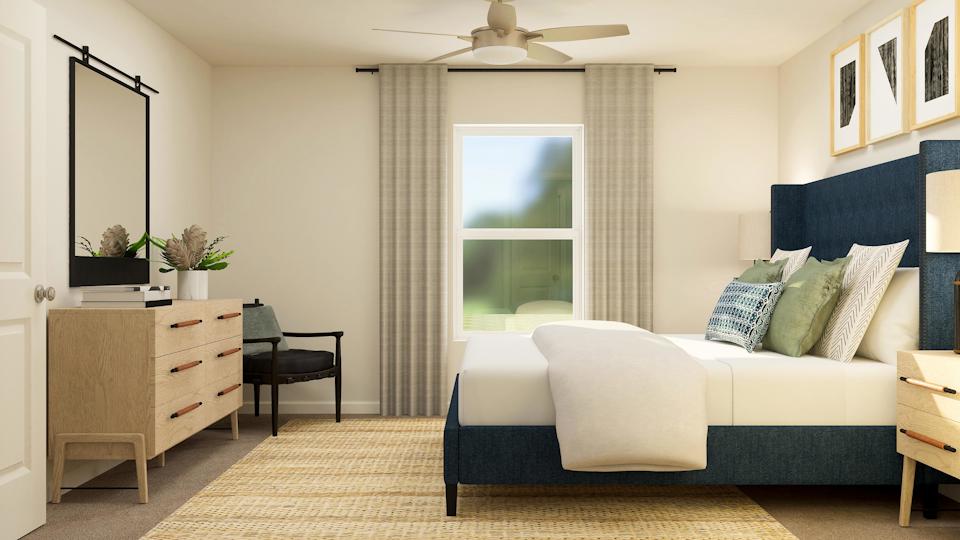 A room with a bed and a table.