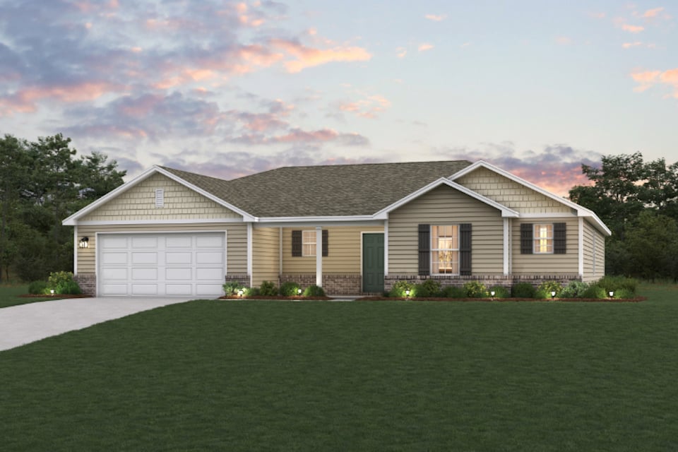 A house with a lawn in front of it.