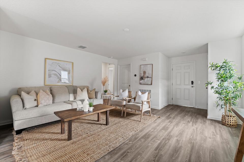 A living room with a couch and a coffee table.