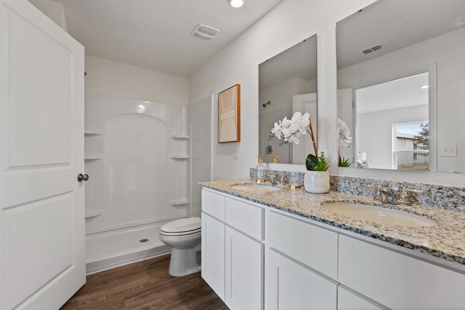 A bathroom with a marble countertop.