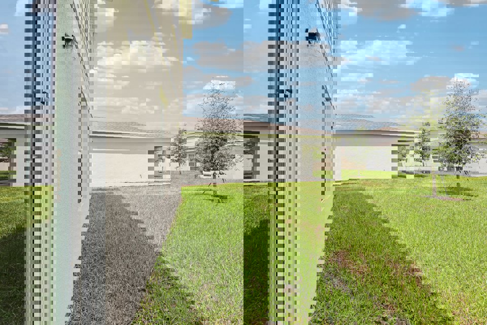 A house with a grass yard.