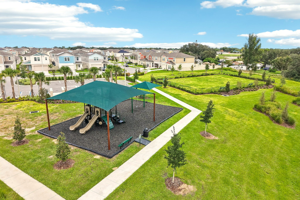 A golf course with a golf cart.