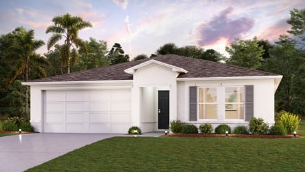 A white house with a lawn.