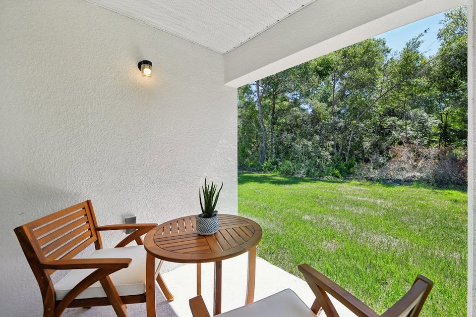 A table and chairs in a room.