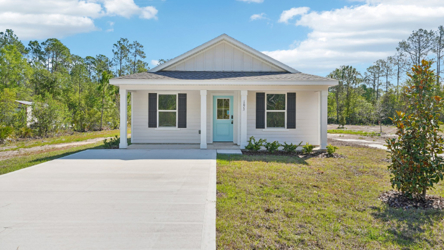 A white house with a blue door.