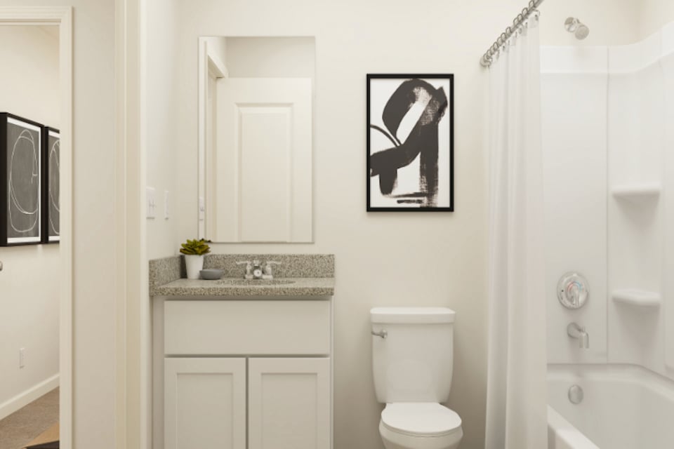 A bathroom with a toilet and a sink.