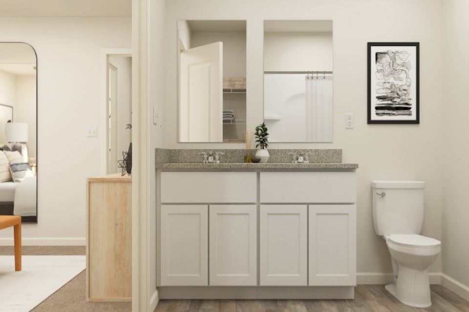 A bathroom with a marble countertop.
