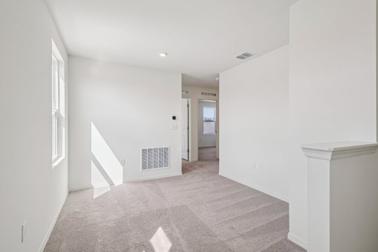 A hallway with white walls.