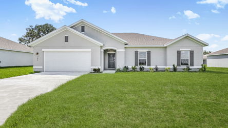 A house with a green lawn.