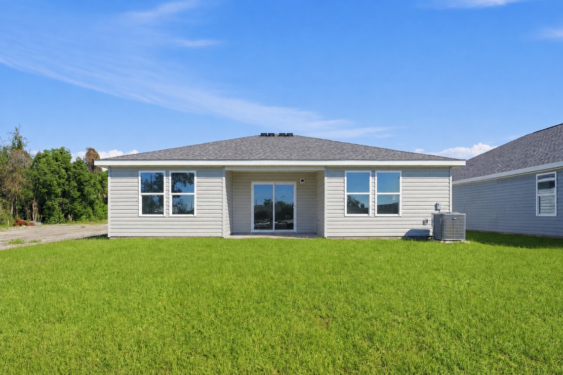 A house with a grass yard.
