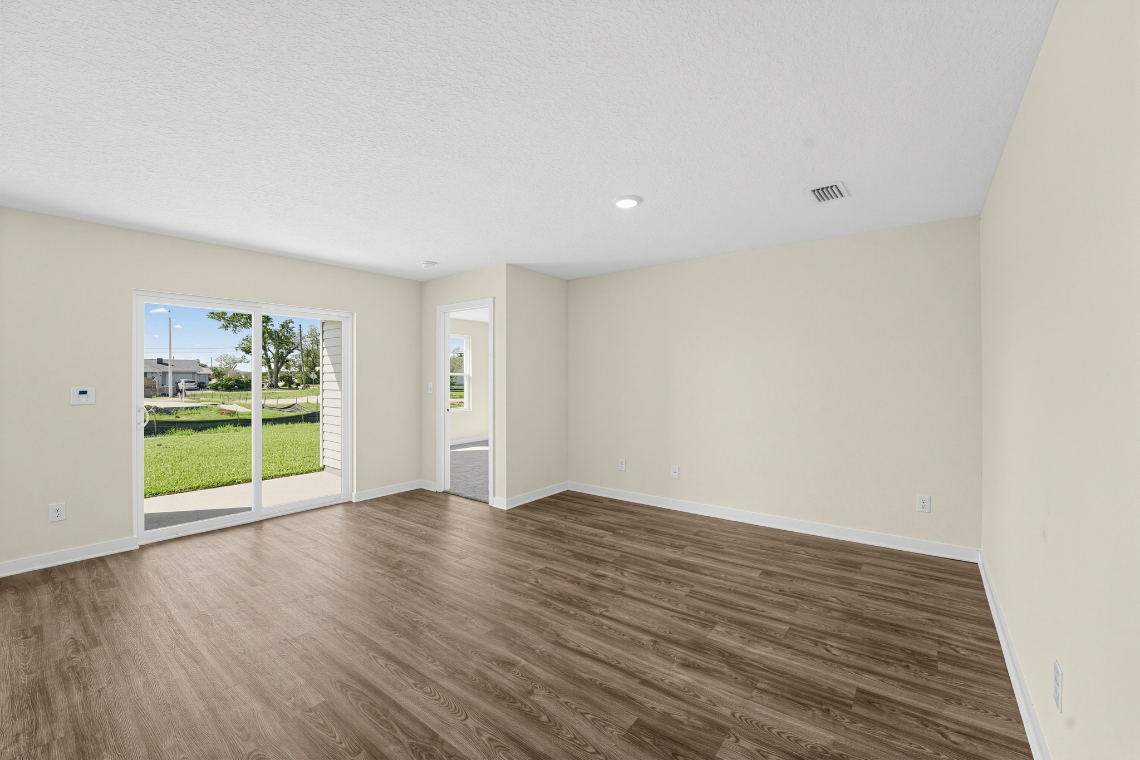 A room with a wood floor and a wood floor.