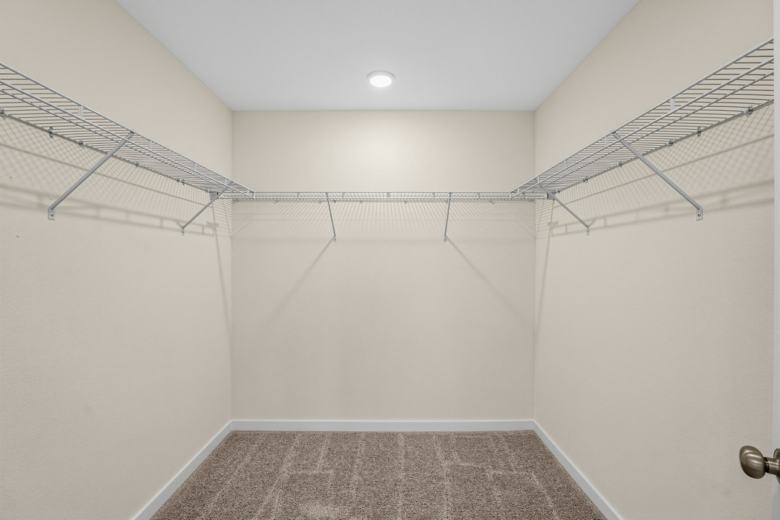 A room with a tile floor and a light on the ceiling.