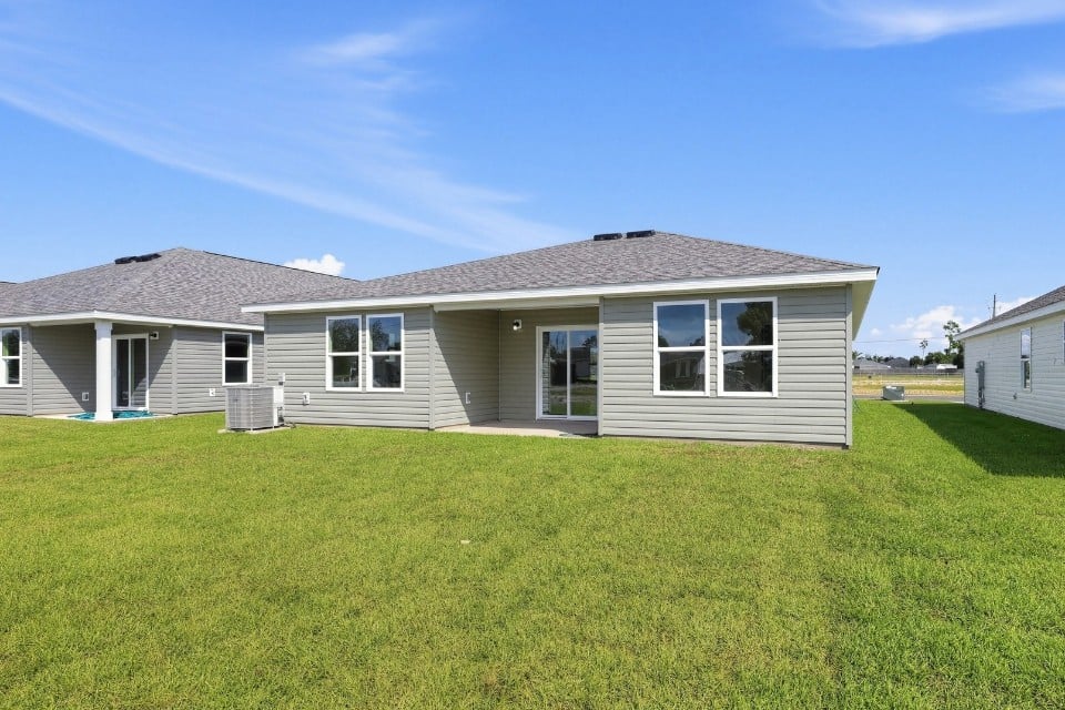 A house with a lawn in front of it.