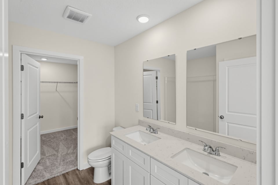 A bathroom with a sink toilet and shower.