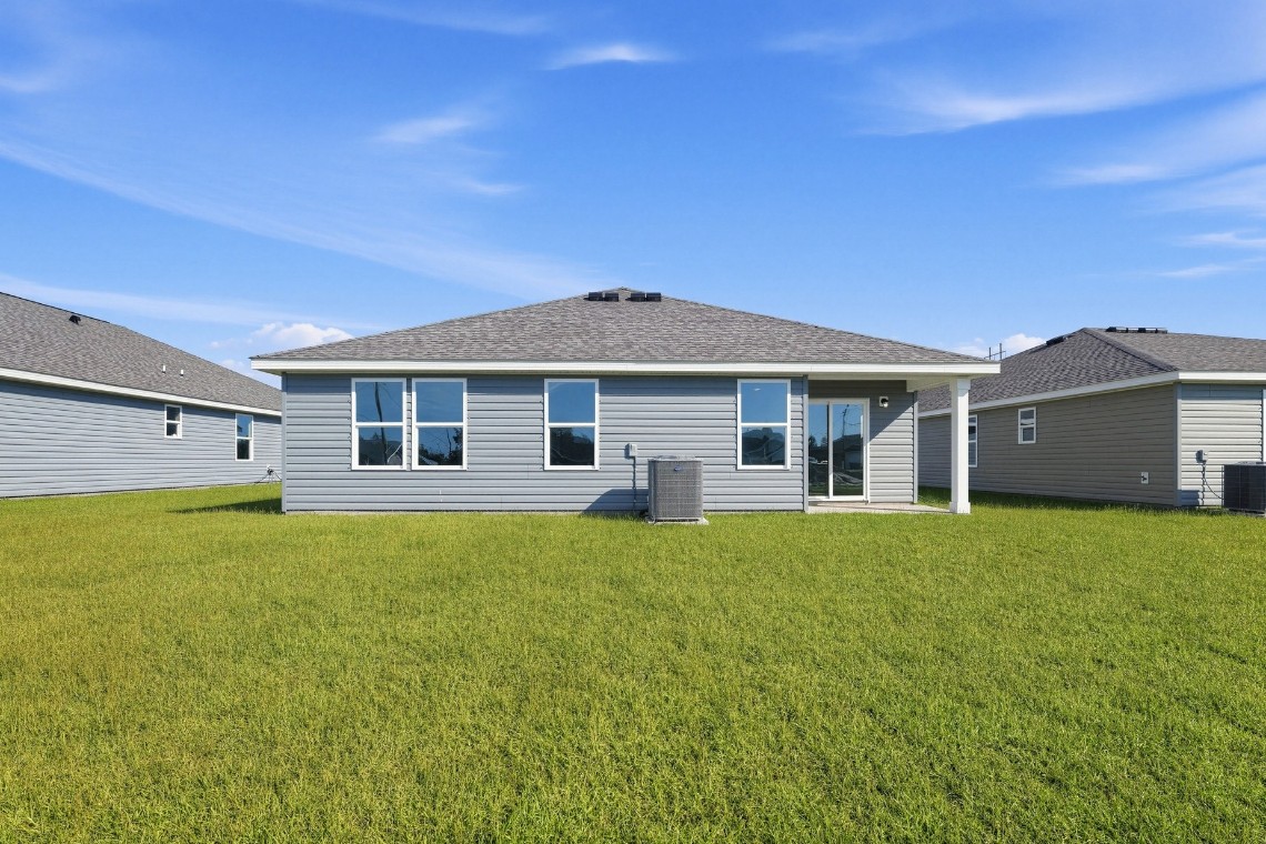 A house with a grass yard.