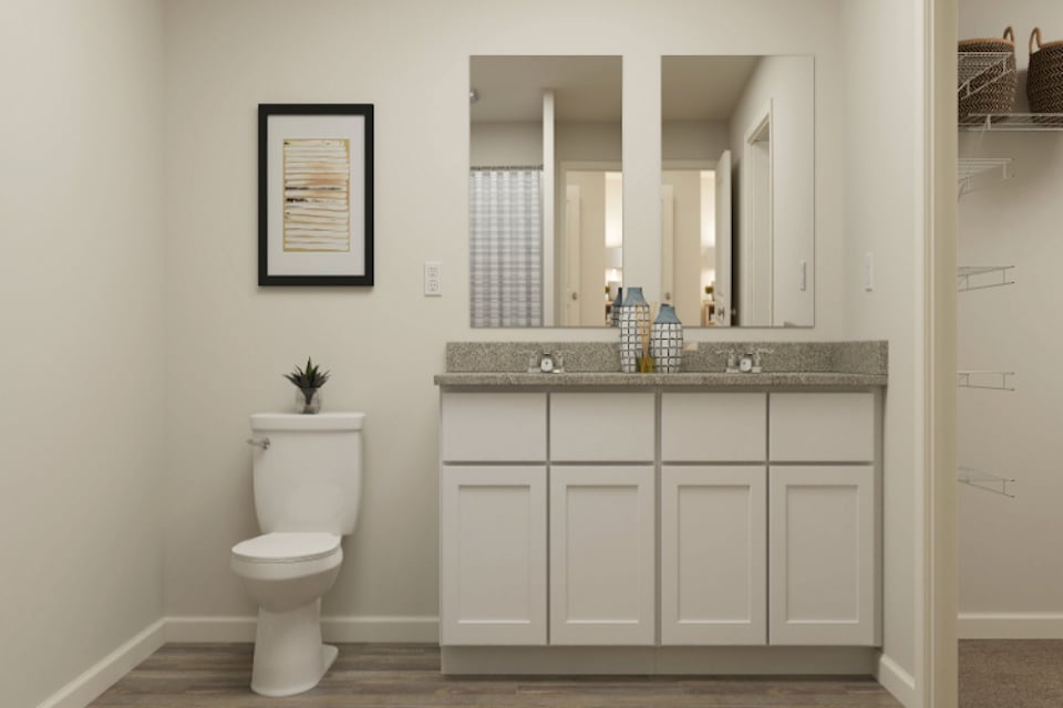A bathroom with a toilet and sink.