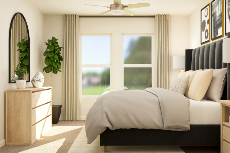 A bedroom with a large window.