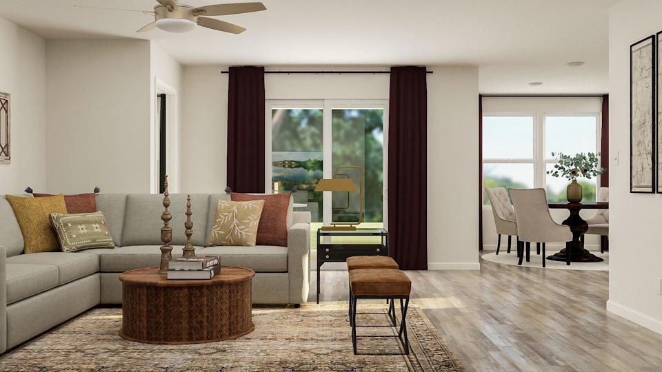 A living room with a couch and chairs.