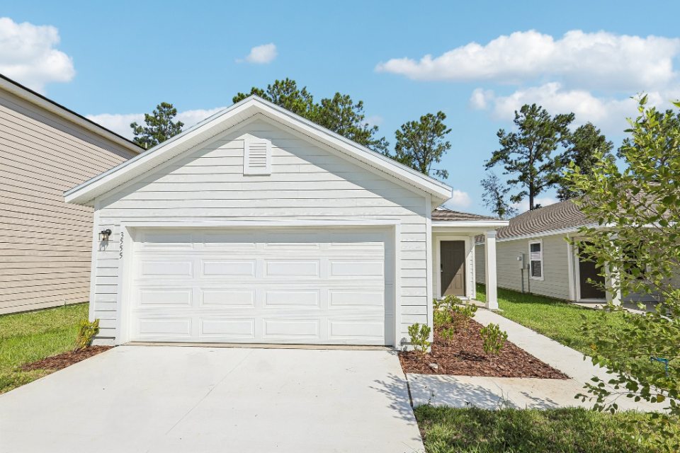 A white garage with a garage.