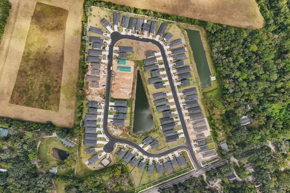 A large building with a parking lot.