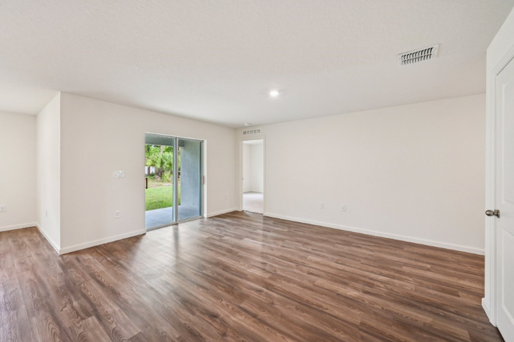 A room with a wood floor and a wood floor.