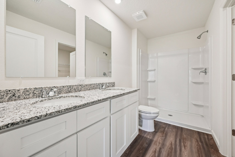 A bathroom with a marble countertop.