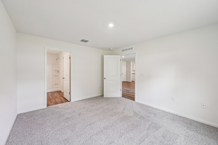 A hallway with white walls.