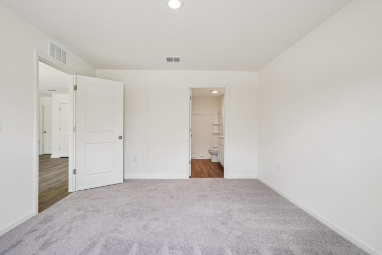 A hallway with white doors.