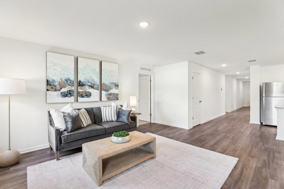 A living room with a couch and a coffee table.