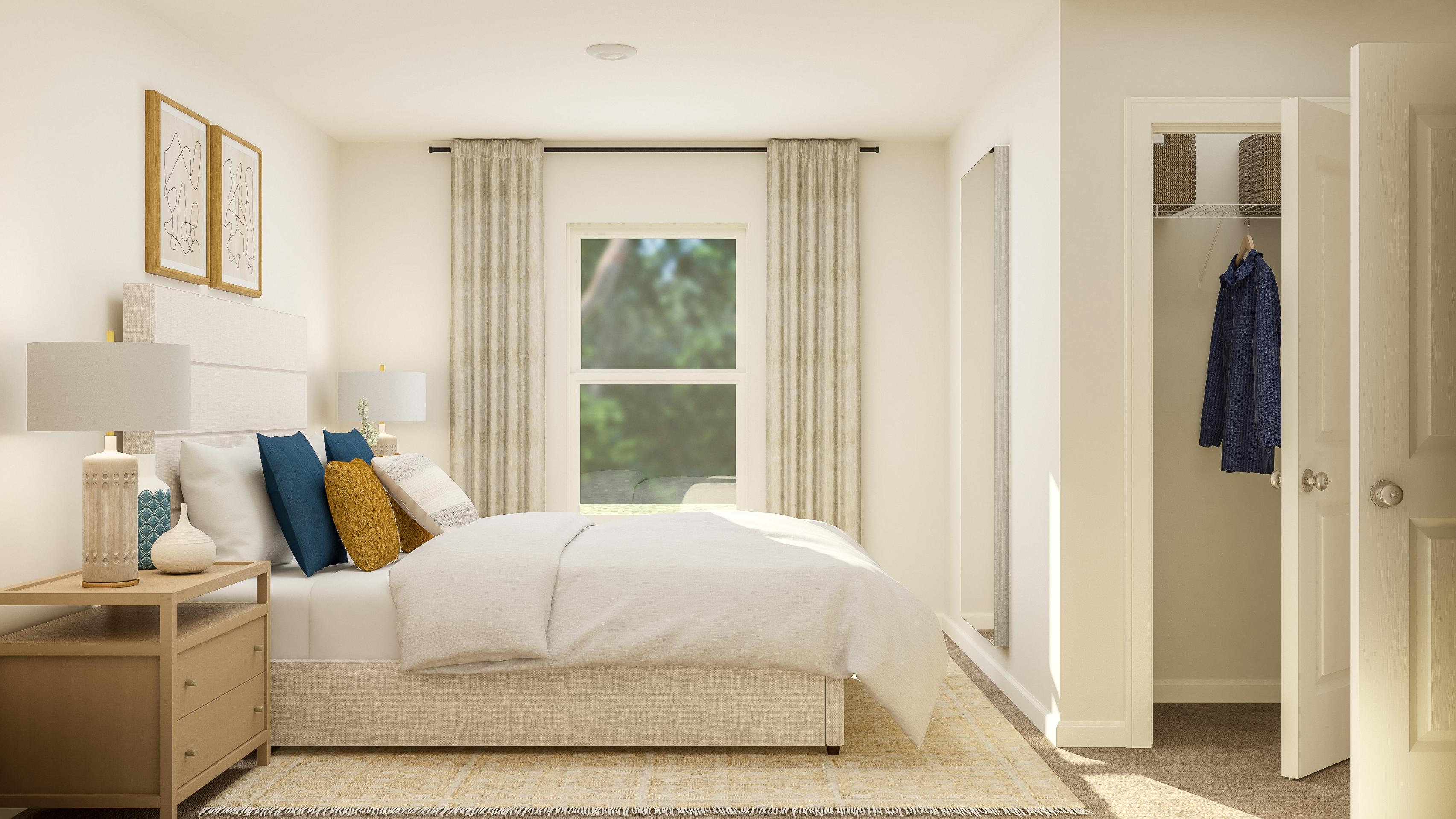 A bedroom with a bed and a window.