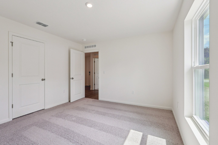 A hallway with white doors.