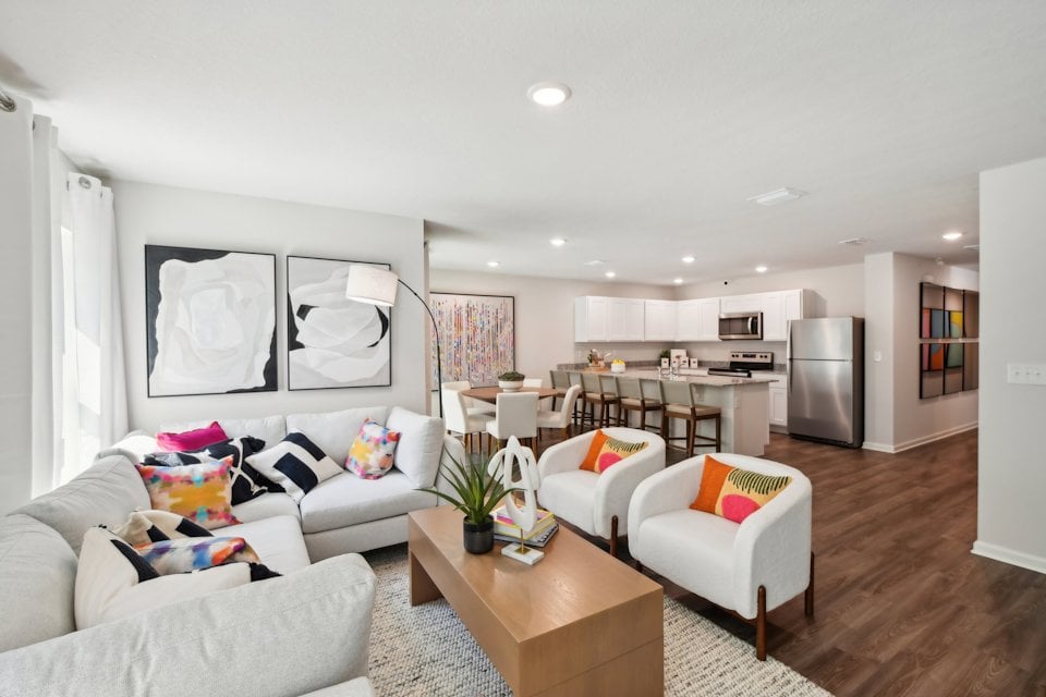A living room with a large dining area.
