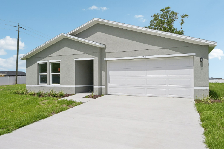 A white garage with a driveway.