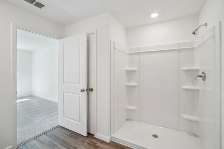 A bathroom with a tub and sink.