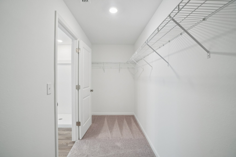 A hallway with white doors.