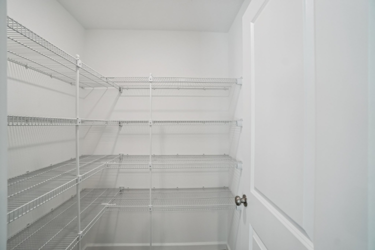 A white staircase in a room.