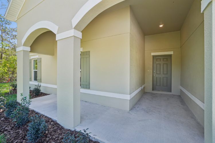 A building with pillars and a door.