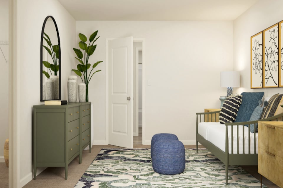 A room with a bed and a chair.