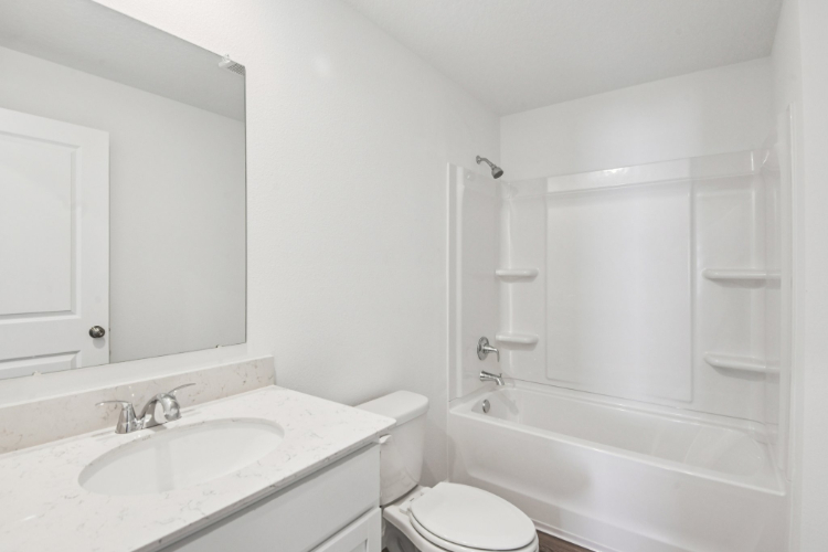 A bathroom with a sink and a toilet.