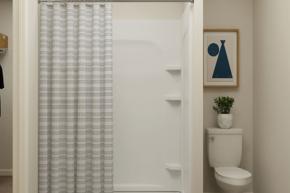 A bathroom with a shower curtain.