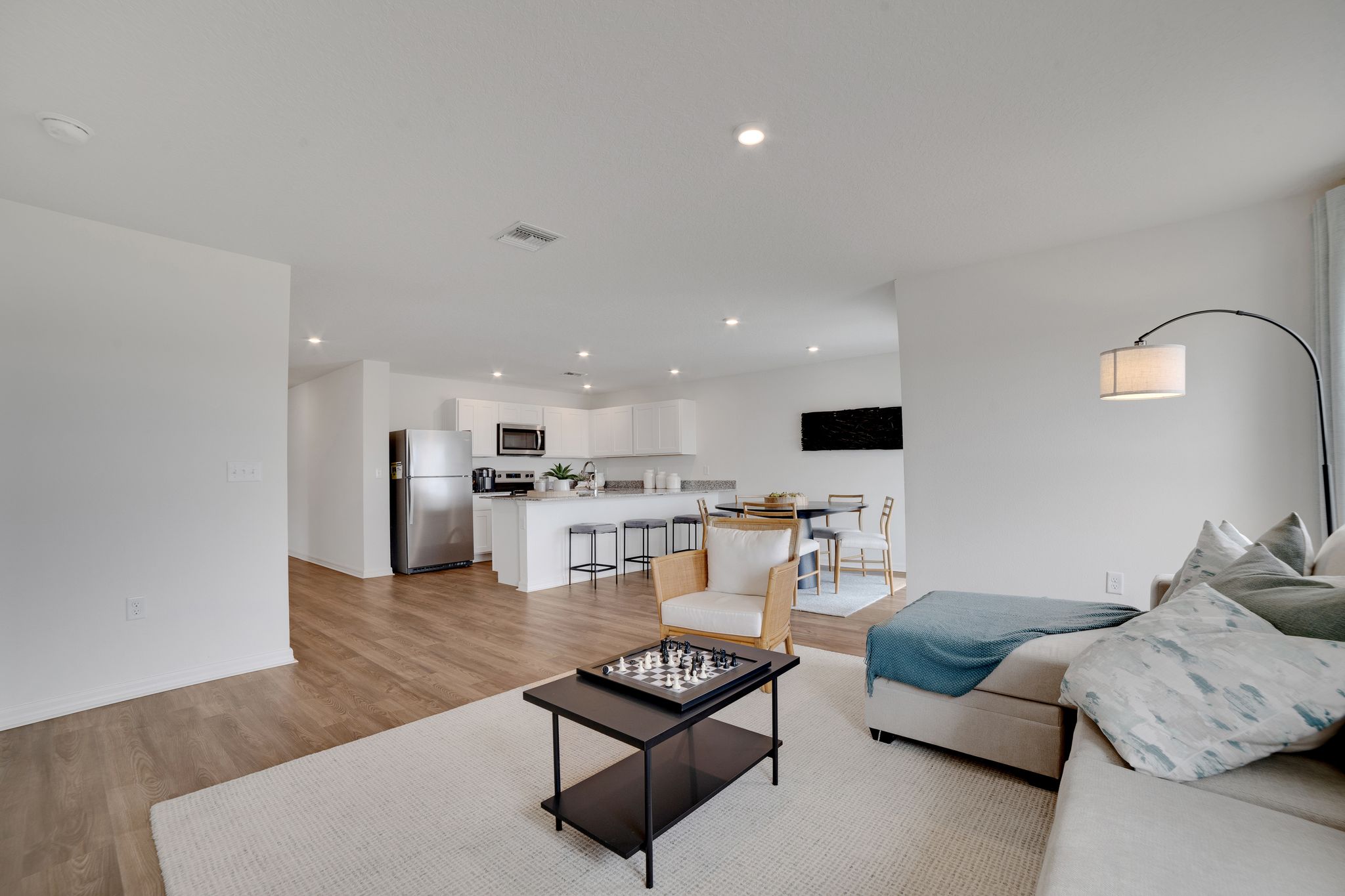 A living room with a bed and a couch.
