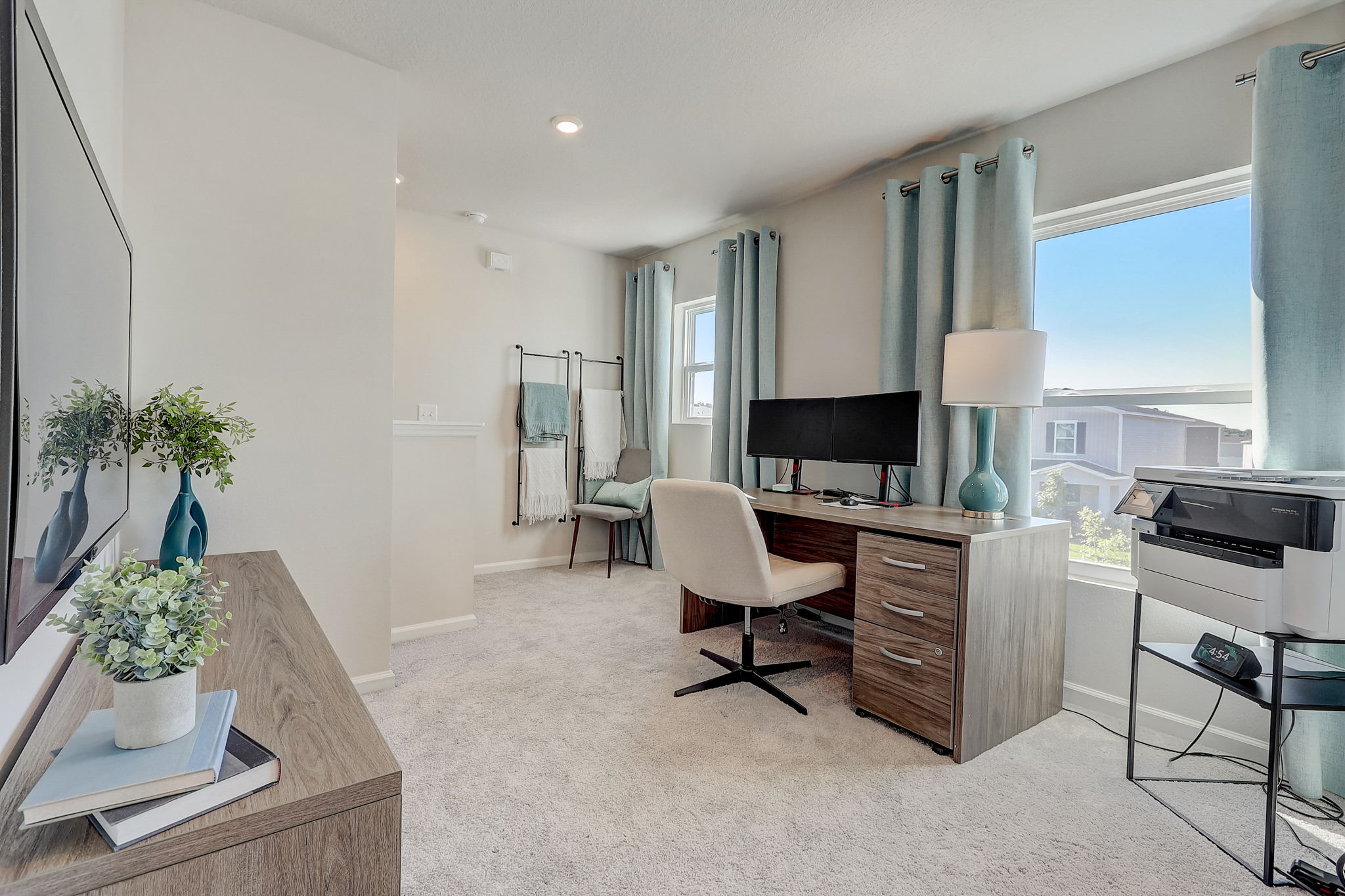 A room with a desk and a chair.