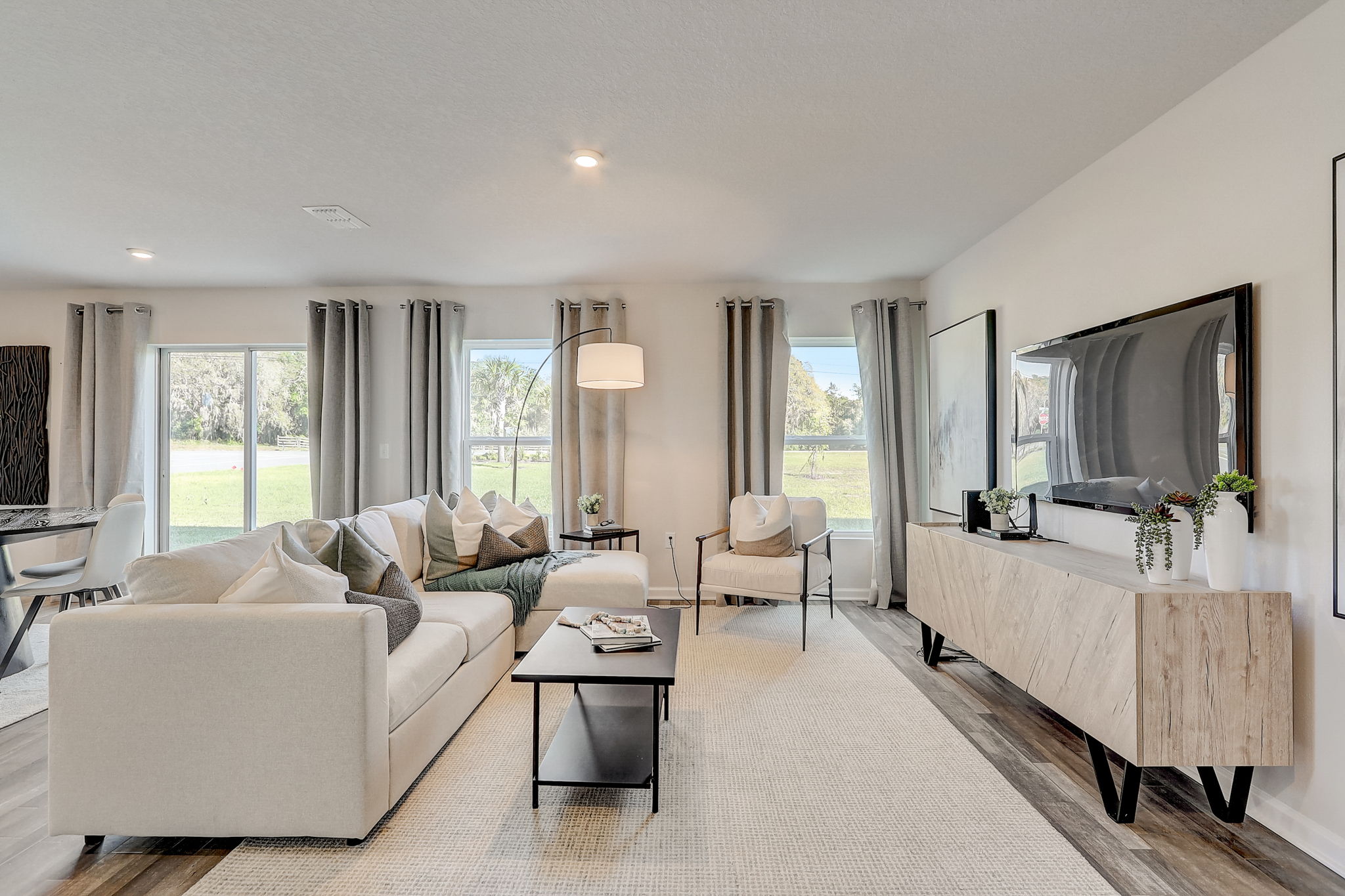 A living room with a large mirror.
