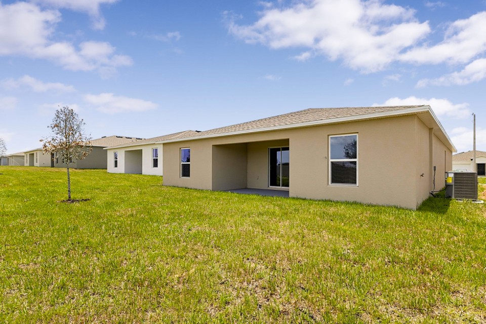 A house with a grass yard.