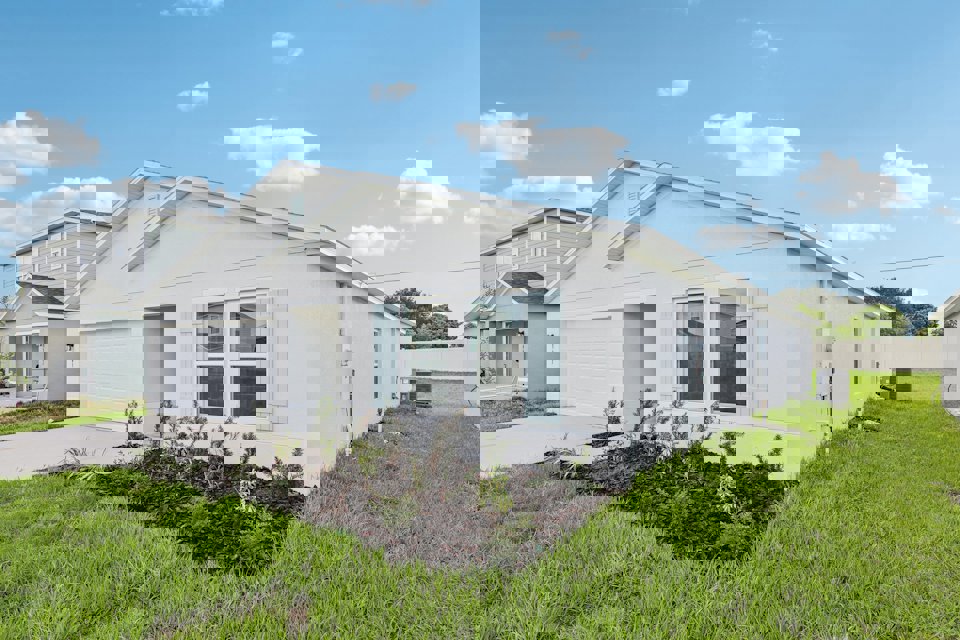 A white house with a blue roof.