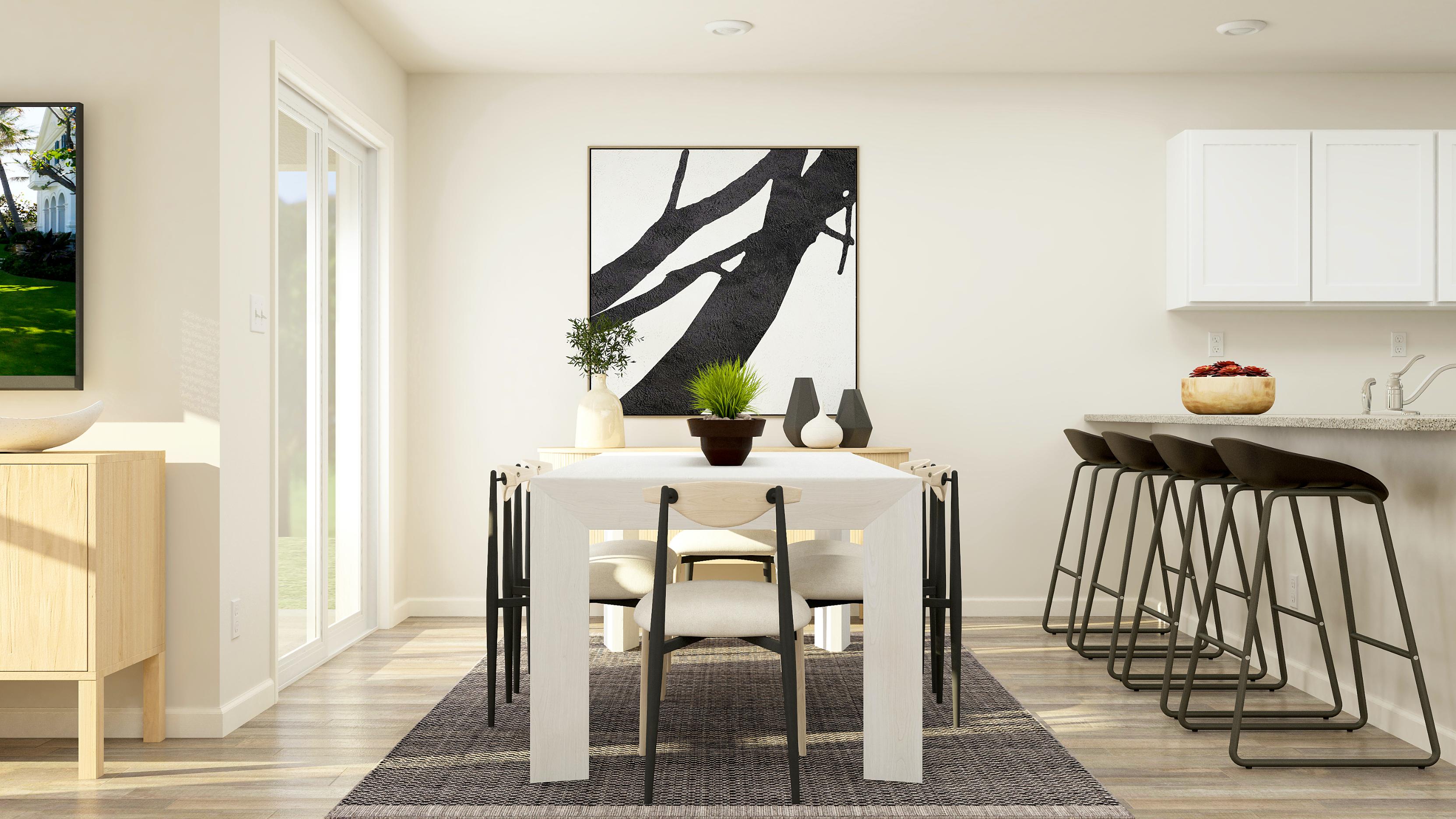 A dining room with a table and chairs.