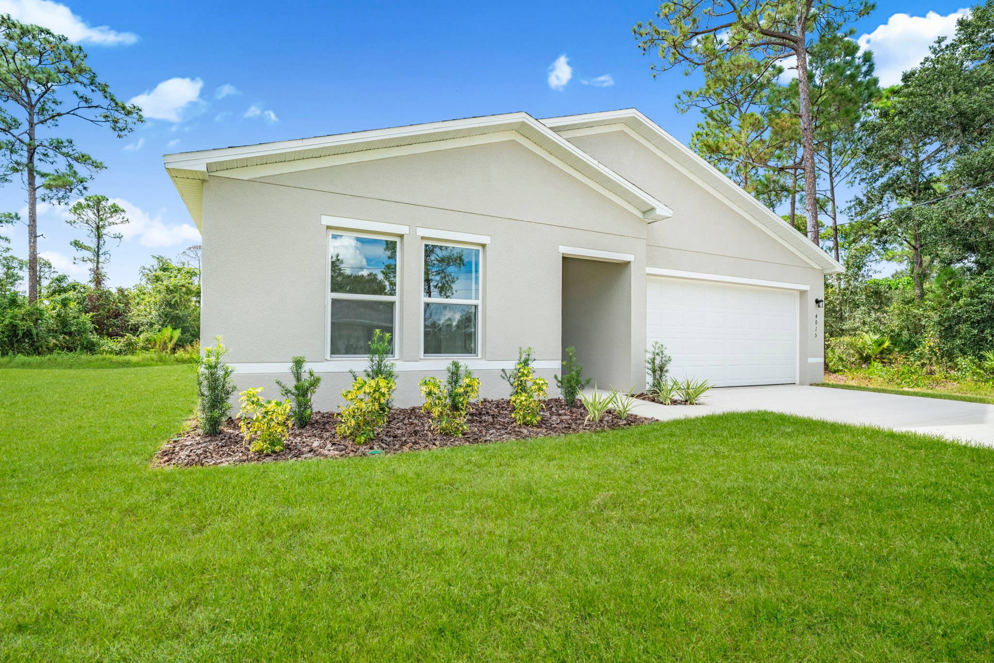 A house with a lawn and trees.