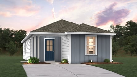 A white house with a driveway.