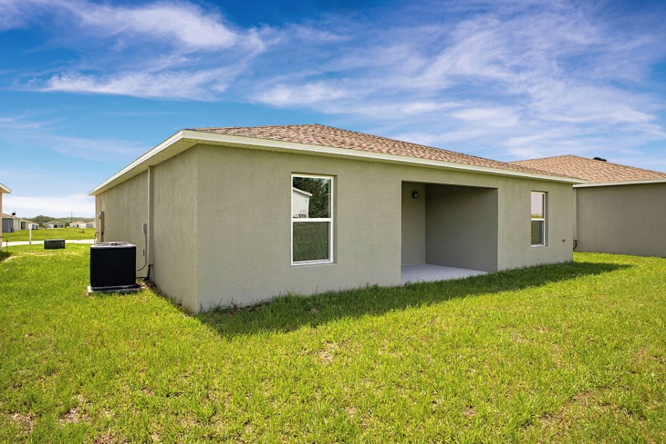 A house with a grass yard.