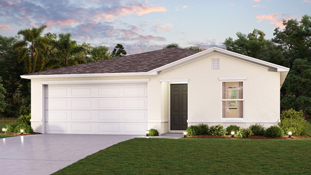 A white house with a lawn.